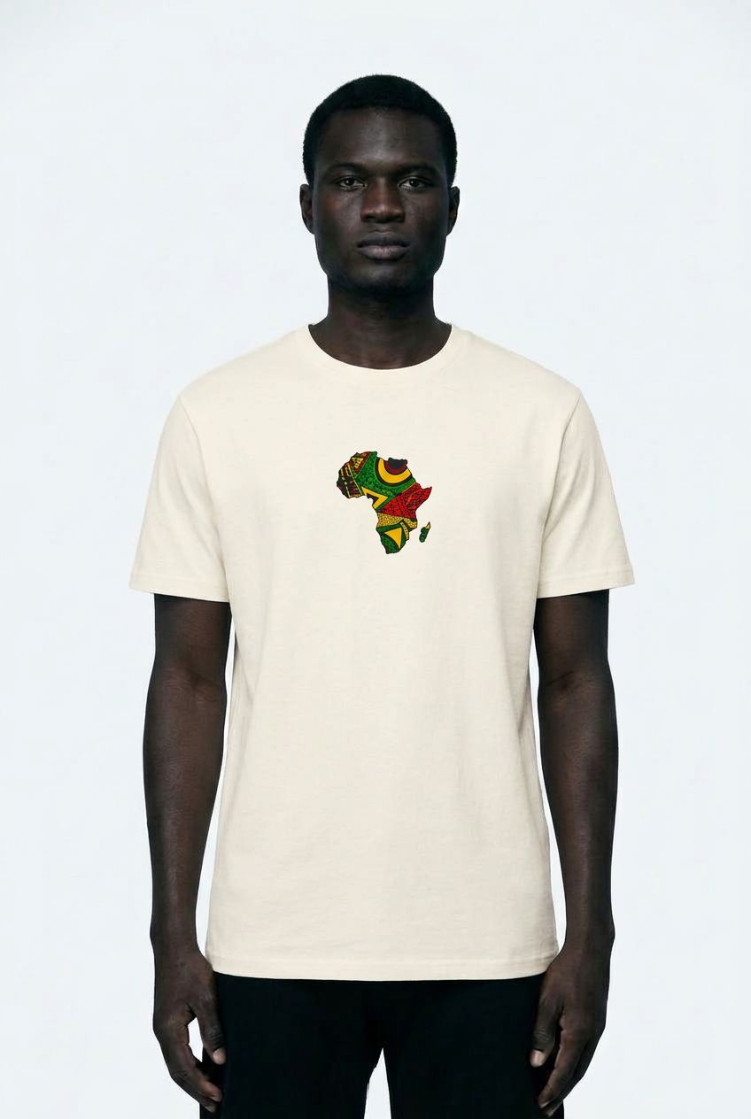 Person wearing a white t-shirt with a colorful graphic design on a plain background